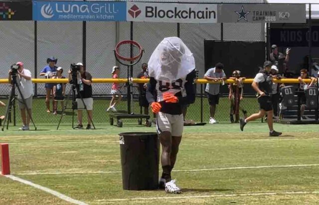 CeeDee Lamb net drill Cowboys training camp sun glare CeeDee Lamb catching a pass with the net over his helmet